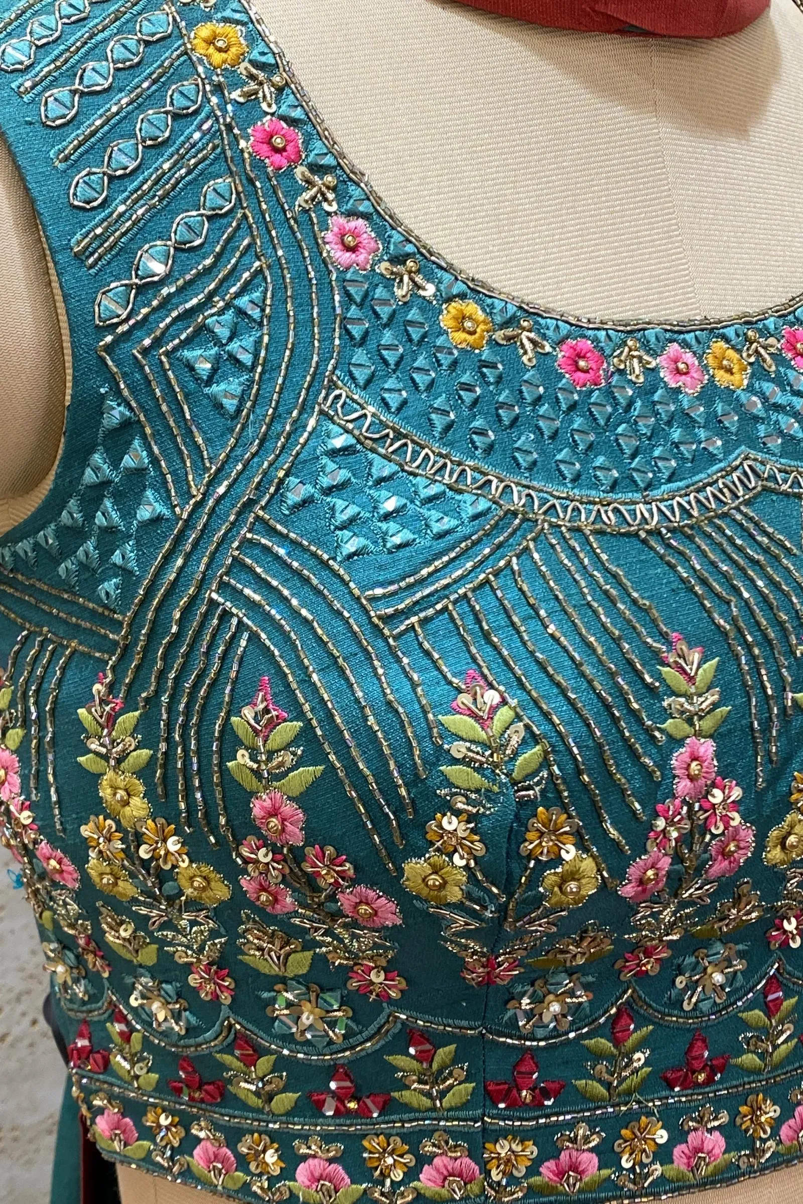 Green and Rust Thread, Beads, Sequins and Mirror work with Floral Print Crop Top Lehenga