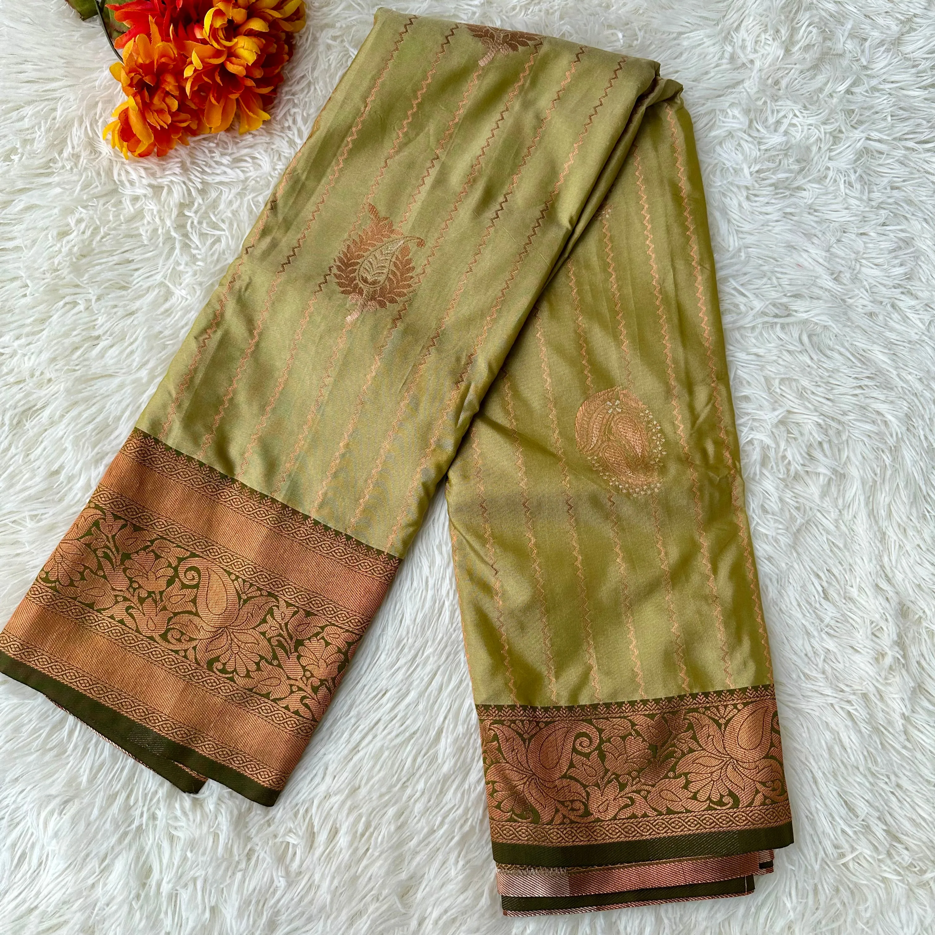 The Natural Beauty Olive Green Color Saree With The Rich Copper Zari border