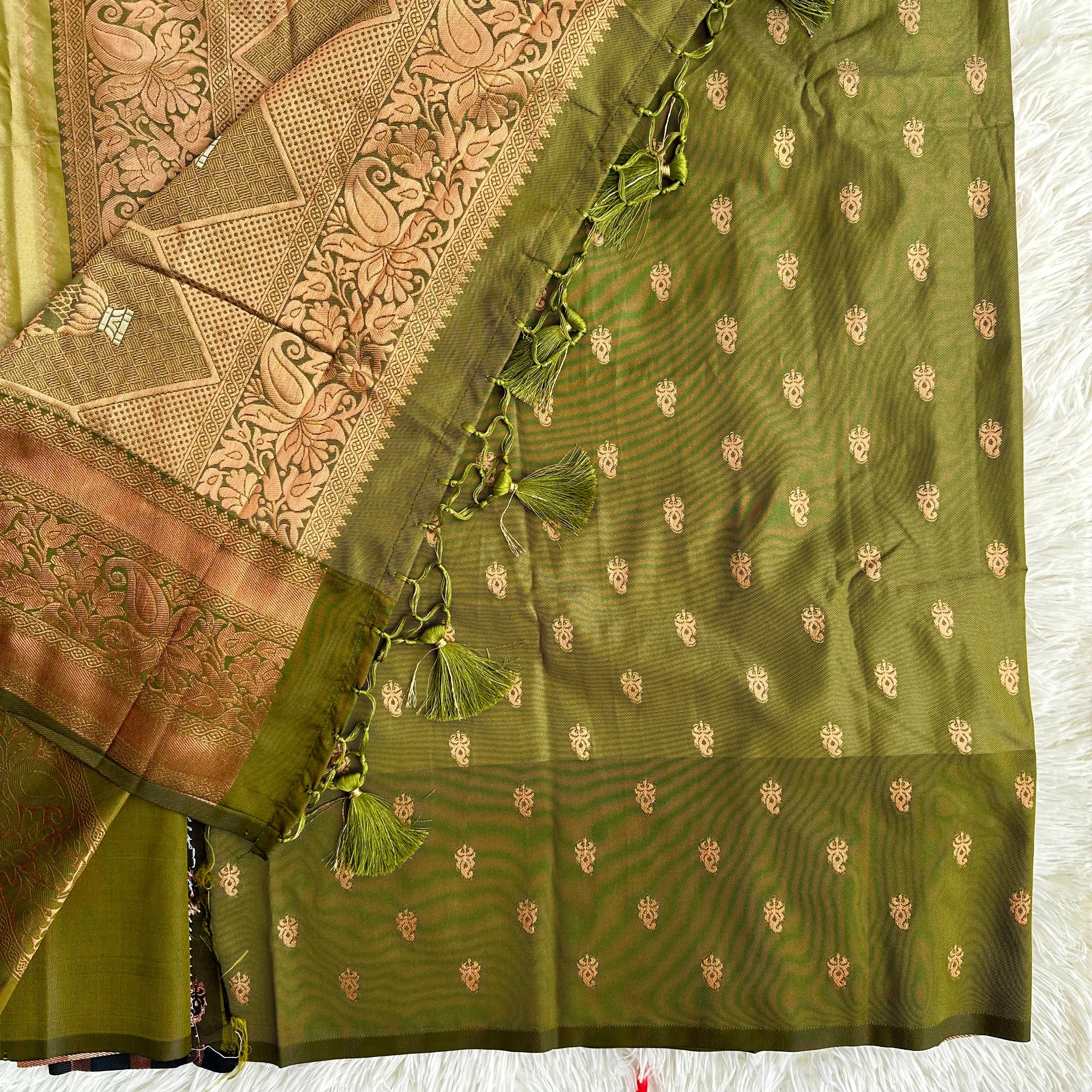 The Natural Beauty Olive Green Color Saree With The Rich Copper Zari border